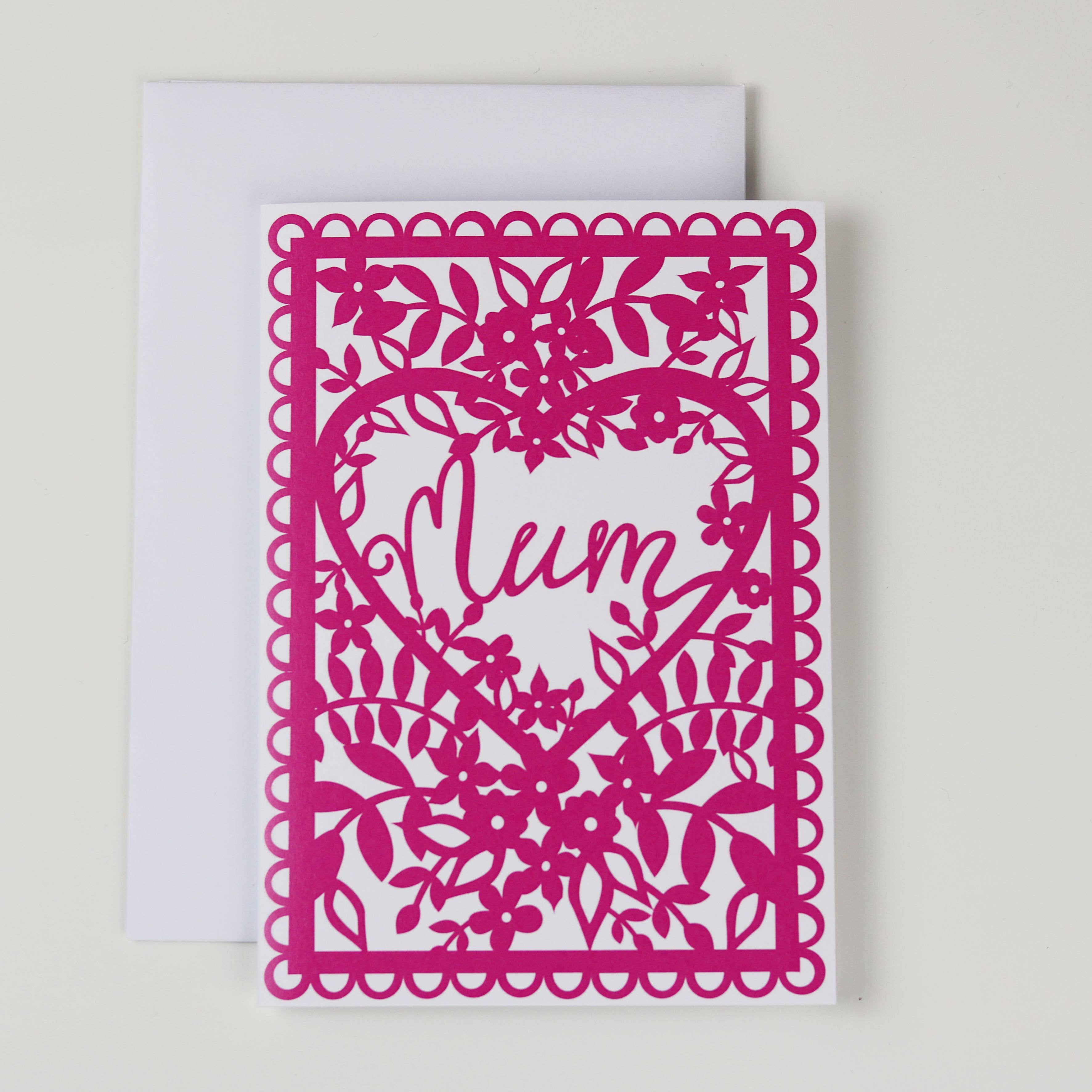 Pink laser-cut card with 'Mum' text on a white background