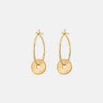 Gold hoop earrings on a white background