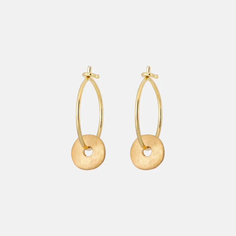 Gold hoop earrings on a white background