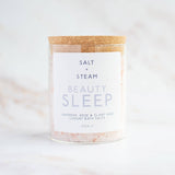 Bath salts container labeled 'Salt + Steam Beauty Sleep' on a white background