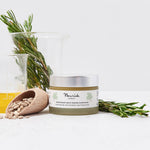 Jar of Nourish product with rosemary and a beaker on a white background