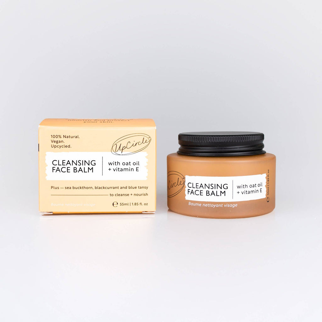Cleansing face balm jar and packaging on a light grey background