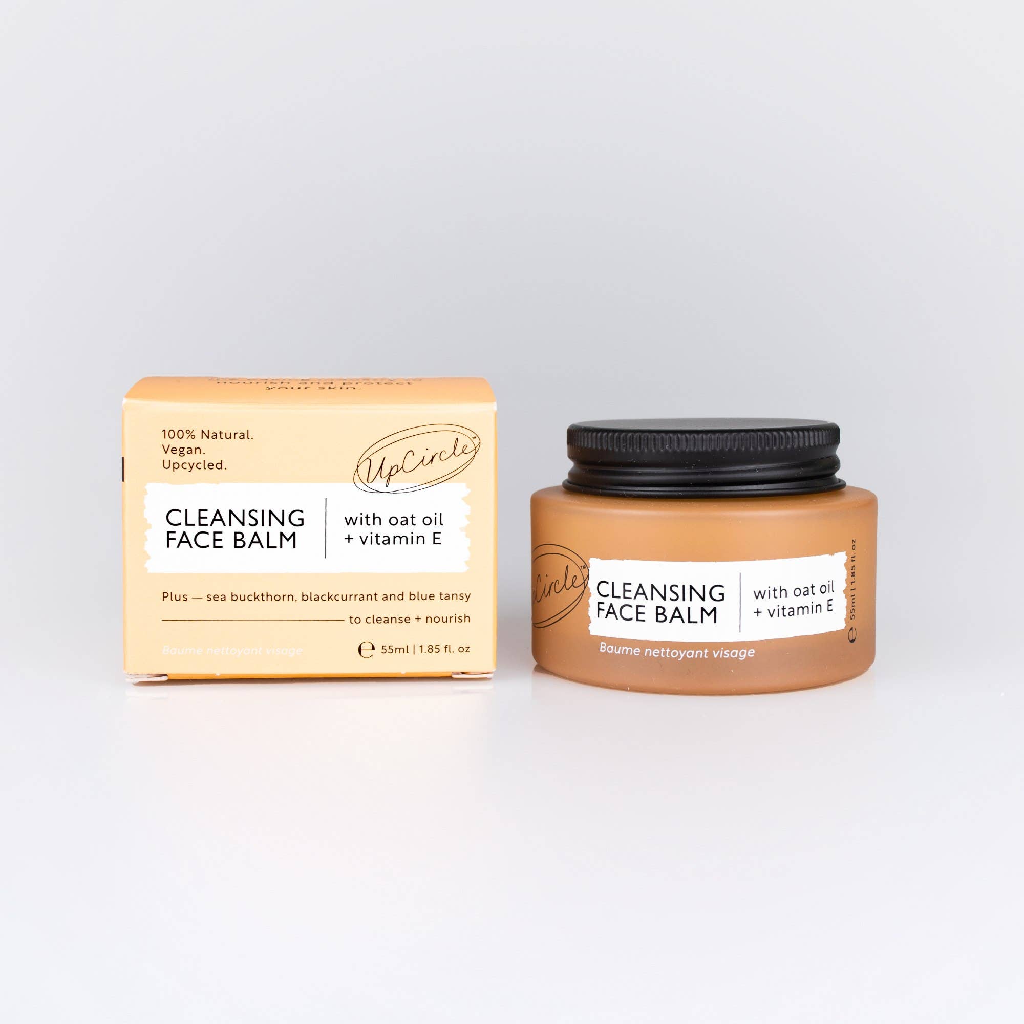 Cleansing face balm jar and packaging on a light grey background