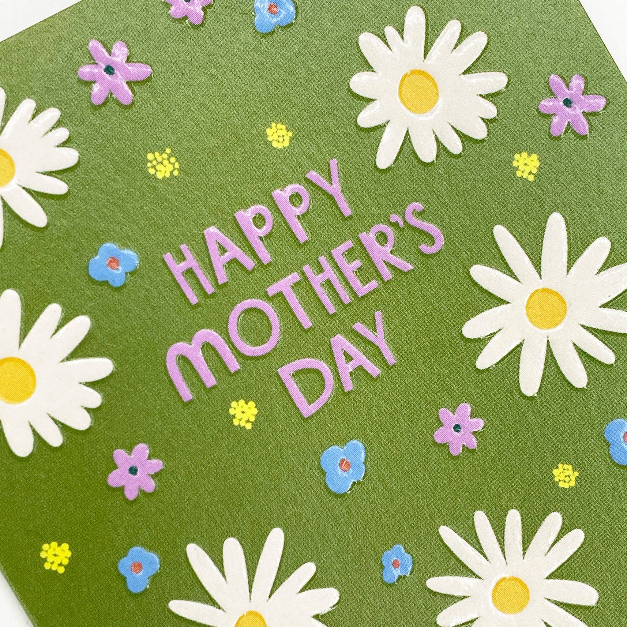 Mother's Day card with white daisies, colorful flowers, and 'Happy Mother's Day' text on a green background.