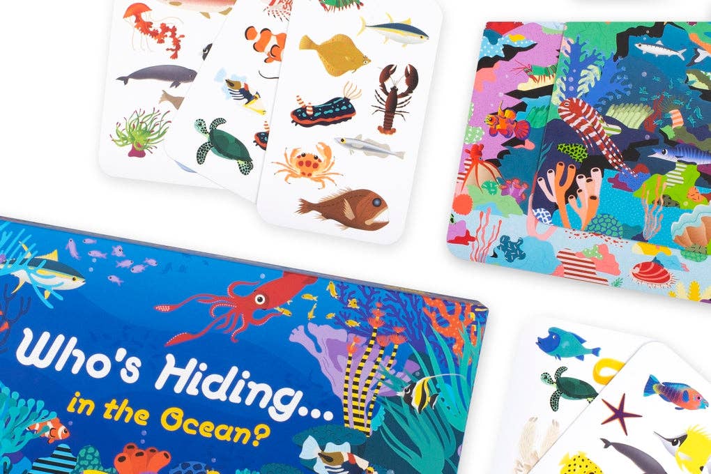 Colorful 'Who's Hiding in the Ocean?' children's game and cards with ocean-themed illustrations on a white background