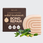 Kitsch Bond Repair solid treatment bar with packaging and bamboo leaves on a light gray background