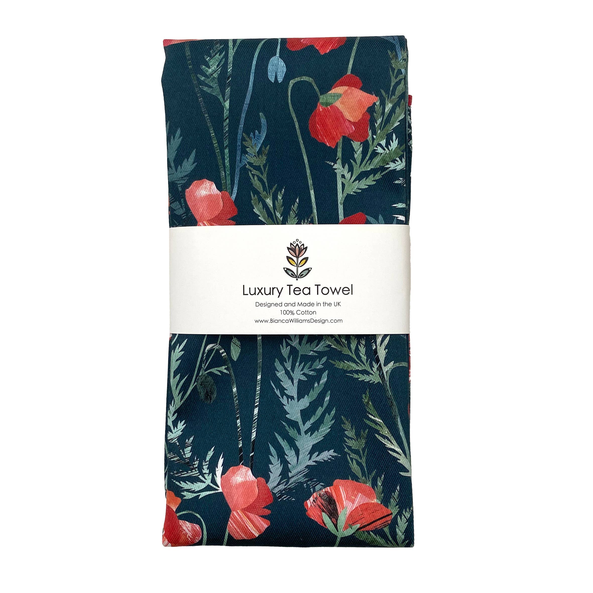 Folded tea towel with red floral poppy design and brand label on a white background