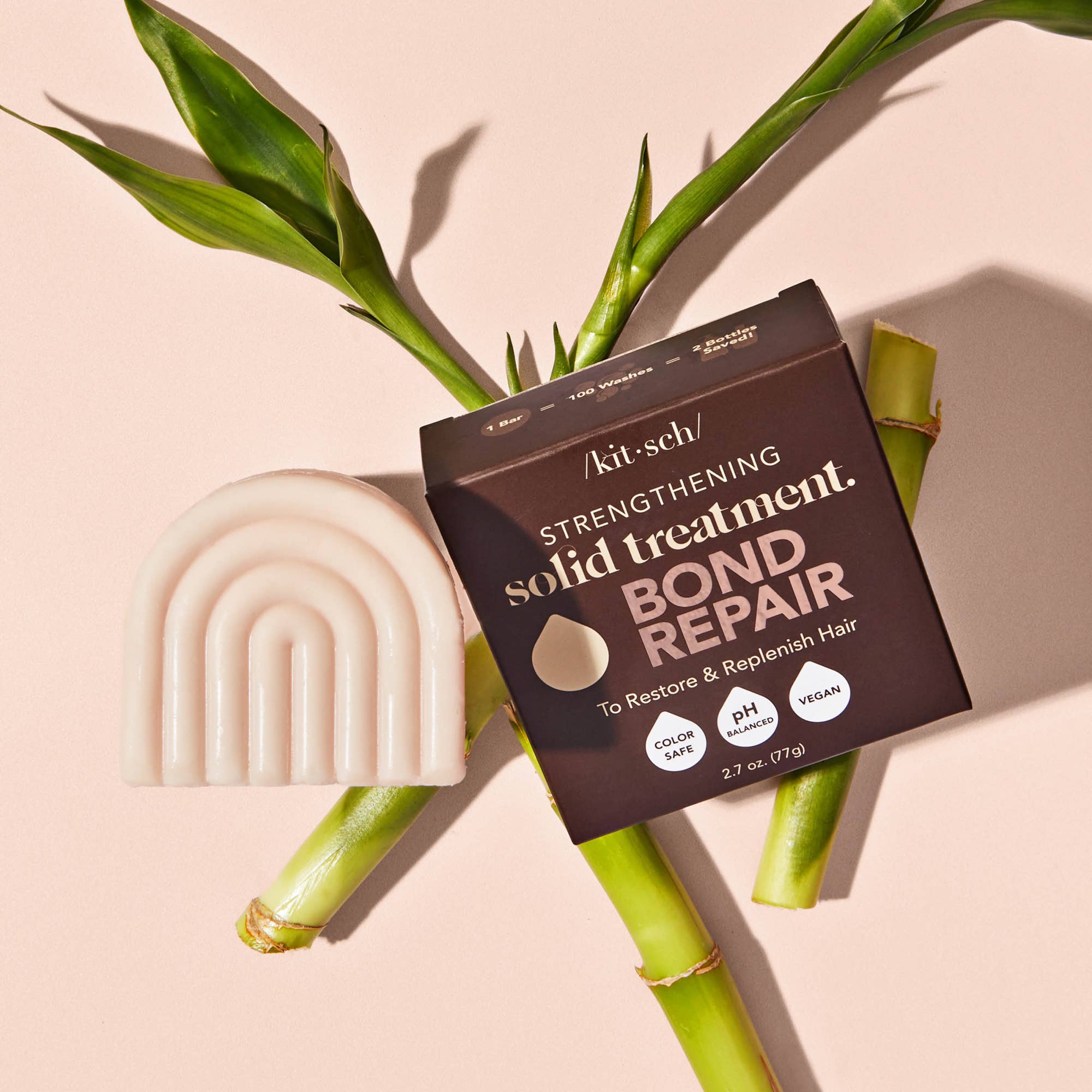 Kitsch strengthening solid treatment bond repair package with a bar of soap and bamboo on a beige background