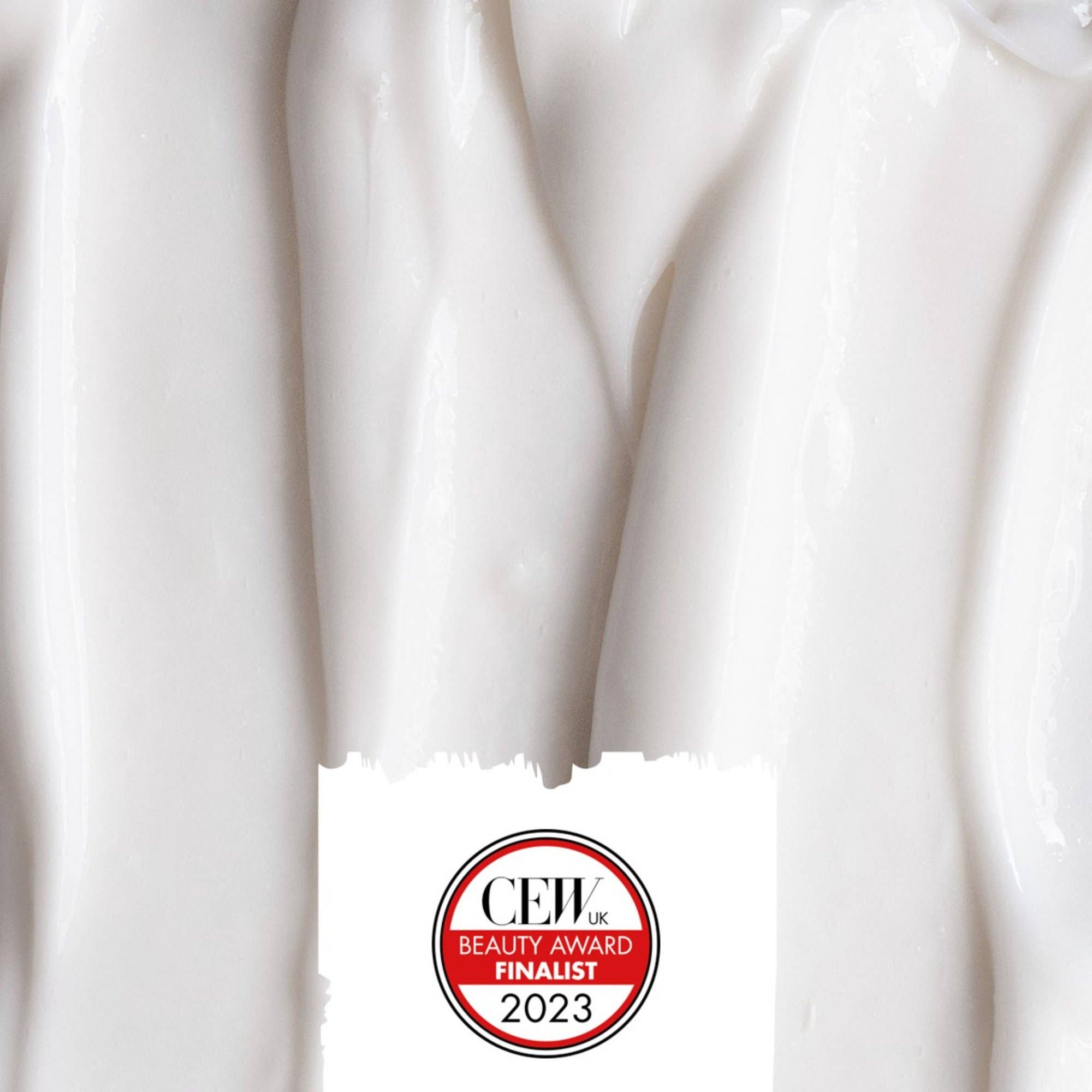 Close-up of white cream with a CEW Beauty Award Finalist 2023 badge.