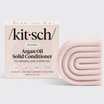 Kitsch Argan Oil Solid Conditioner packaging and bar on a light gray background