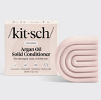 Kitsch Argan Oil Solid Conditioner packaging and bar on a light gray background