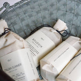 Bars of soap with labels in a woven basket