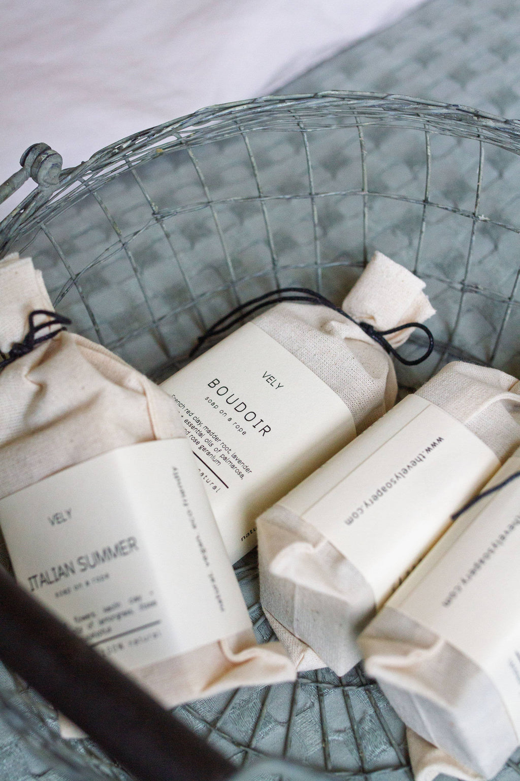 Bars of soap with labels in a woven basket