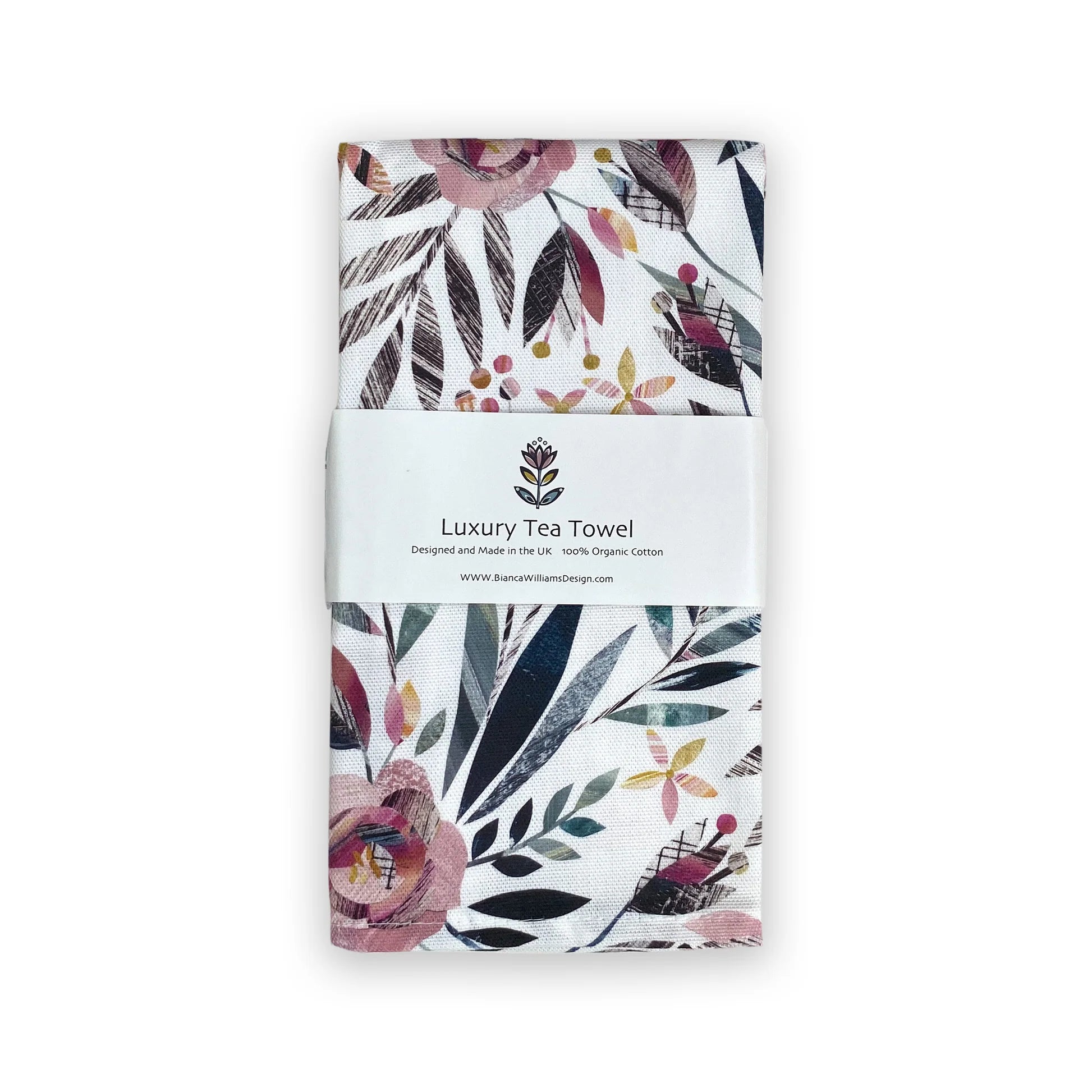 Packaged luxury organic cotton tea towel with floral design on a white background
