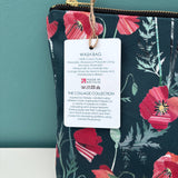 Floral-patterned wash bag with a Made in Britain label on a teal background