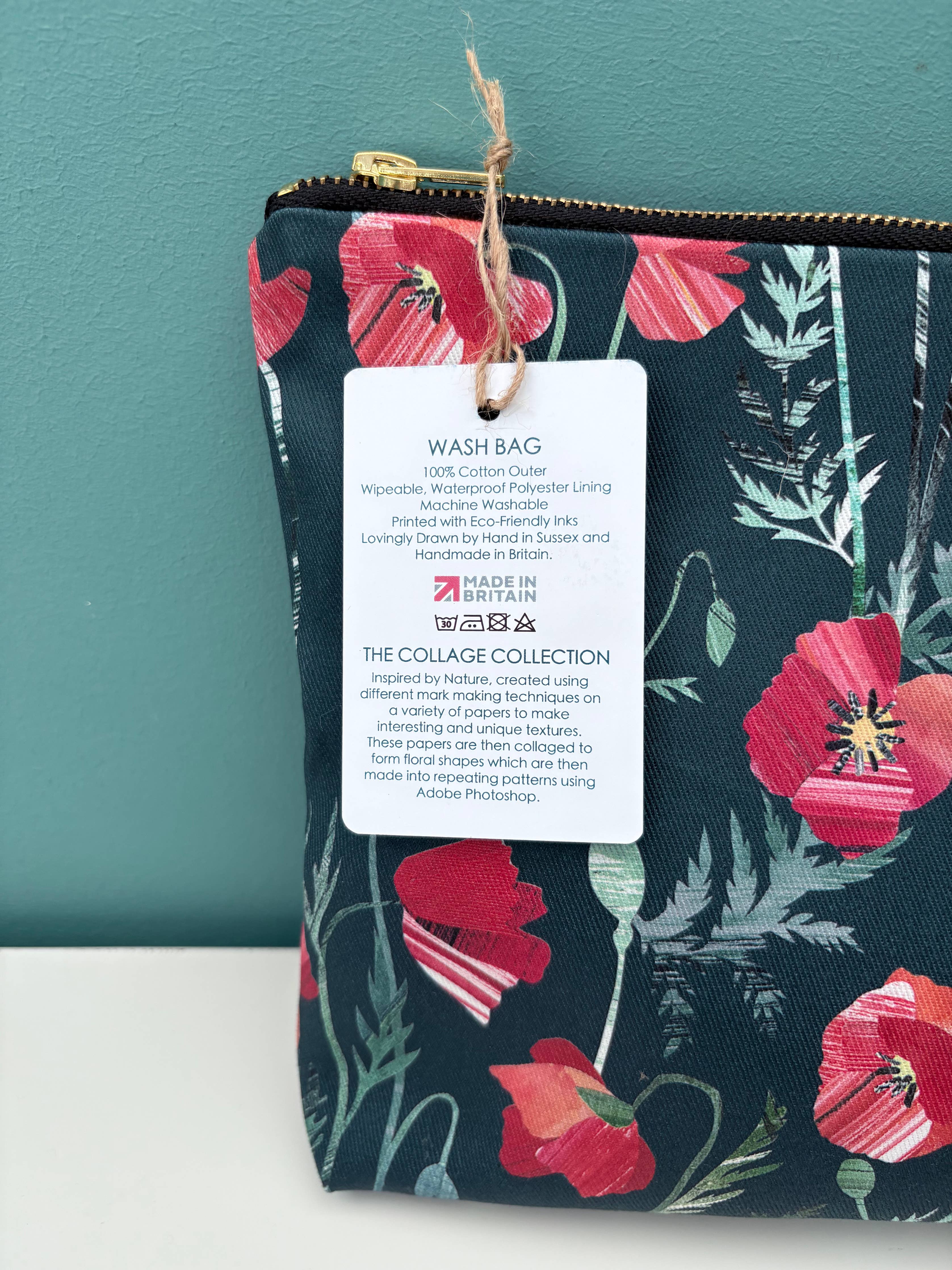 Floral-patterned wash bag with a Made in Britain label on a teal background