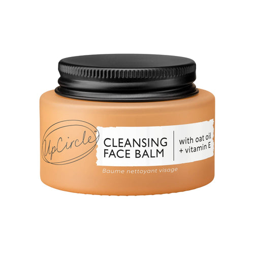 Orange jar with black lid, a visible Upcircle Cleansing Face Balm brand label on a white background