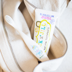 Tube of Jack N' Jill bubblegum-flavored toothpaste in a beige bag.