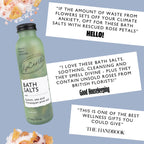 Bottle of UpCircle bath salts with positive reviews from Hello magazine, Good Housekeeping and The Handbook, on a light blue background