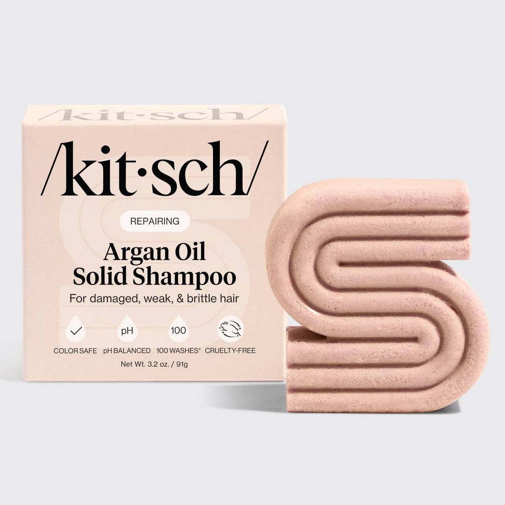 Kitsch argan oil solid shampoo bar and packaging on a light gray background